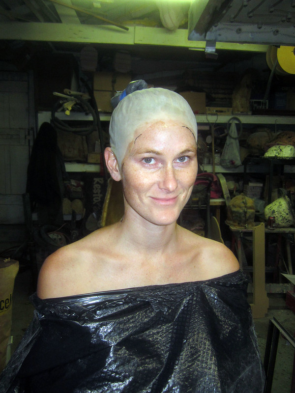 Picture of person with a bald cap that will get a life cast applied.