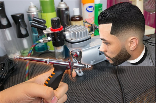Image showing an airbrush makeup applicator and an example of a men's scalp fade so the makeup artists can duplicate the look