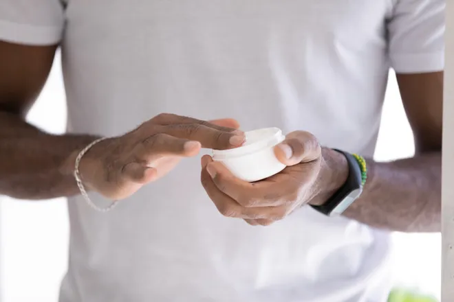 Man using moisturizer